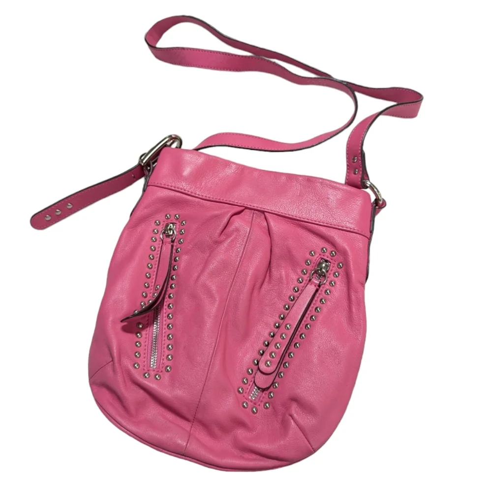 B Makowsky, Pink leather crossbody bag with chrome hardware .